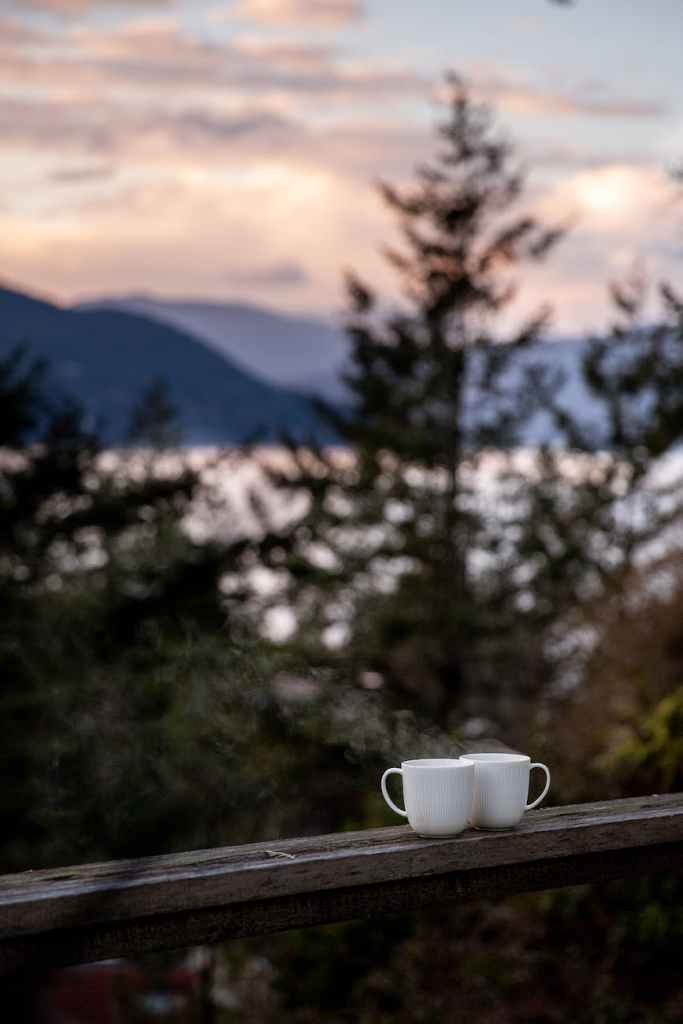 mugs of tea placed on wooden border